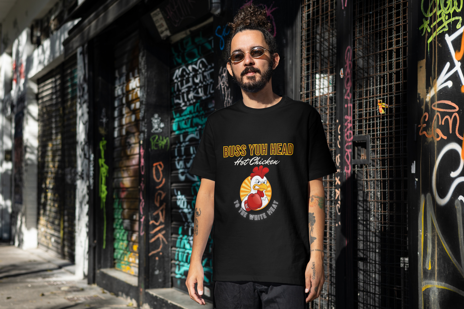 A young man wearing a black t-shirt that says "Don't Let Them Tell You That You Can't Fly". 